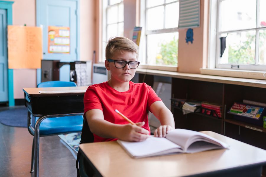 Child doing schoolwork at a desk